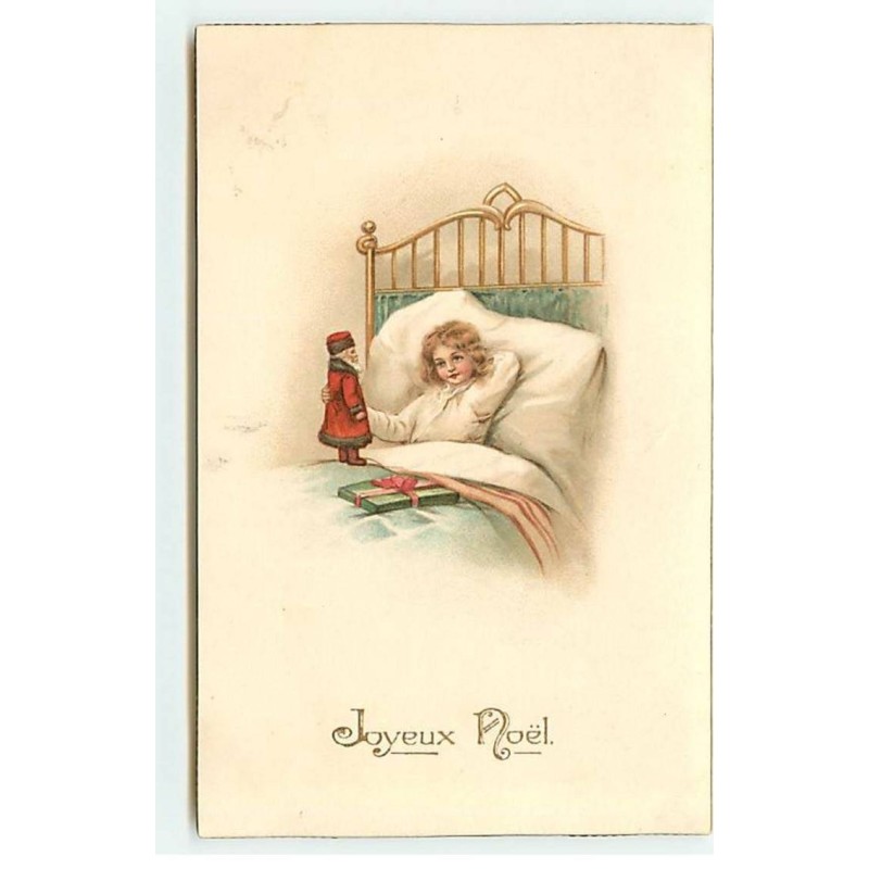 n°21932 - Joyeux Noël - Enfant dans un lit, jouant avec un petit Père Noël