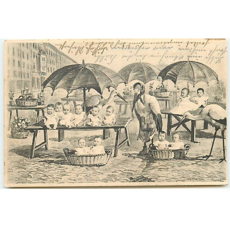 n°22880 - Fantaisie - Bébés sur les étals d'un marché avec des cygognes