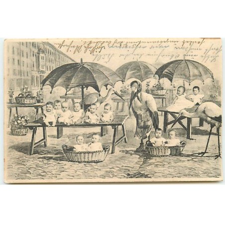 n°22880 - Fantaisie - Bébés sur les étals d'un marché avec des cygognes
