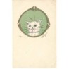 n°25836 - Adym - Chat blanc faisant la tête dans un médaillon vert