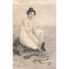 n°27266 - Fantaisie - Jeune femme assise enlevant ses chaussures en bord de mer