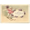 n°13579 - Carte Gaufrée - Bonne Année - Fillette sur des skis avec un bouquet de violettes