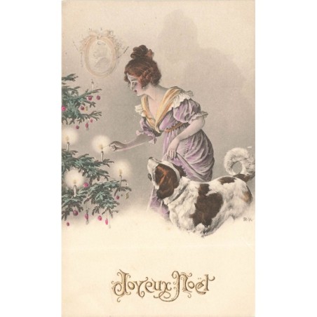 n°29728 - RK - Joyeux Noël - Jeune femme allumant les bougies d'un sapin, à l'aide d'un chien