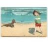 n°14145 - Teckel regardant un garçon faisant pipi sur une plage