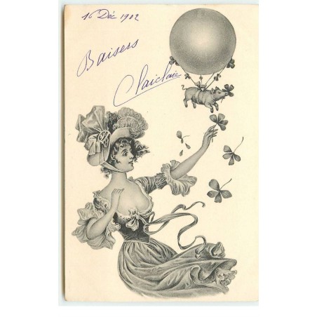 n°16547 - Jeune femme avec un  cochon accroché à un ballon parmi des trèfles
