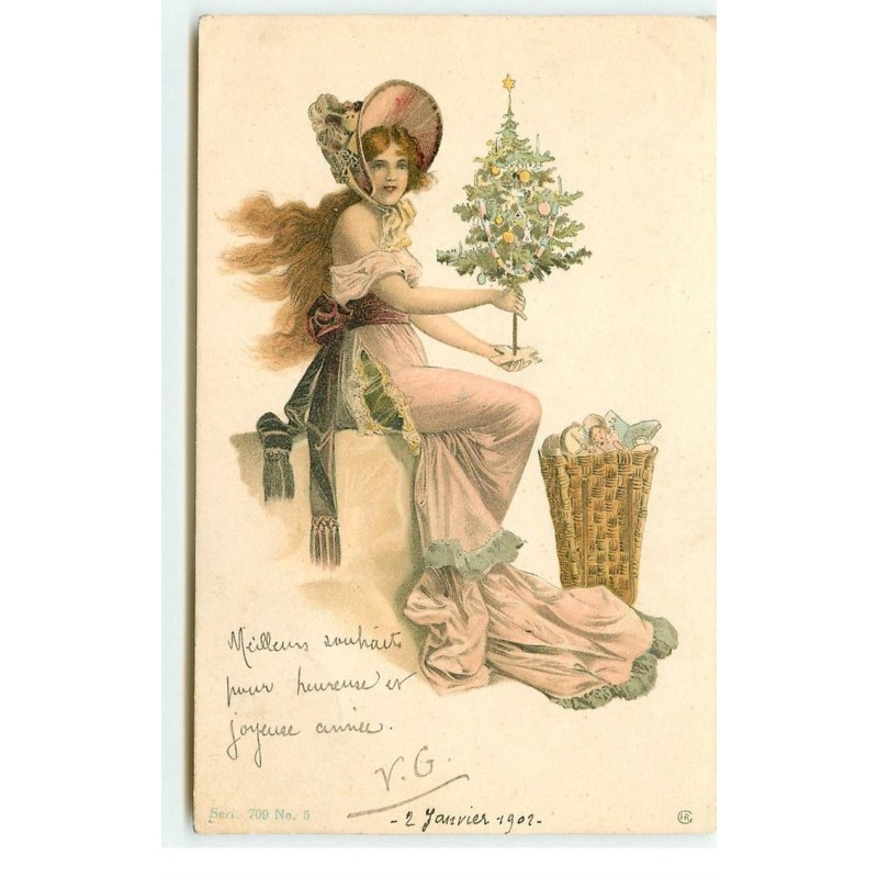n°17126 - Jeune femme tenant un petit sapin décoré