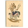 n°17644 - Kellemeshusvétiünnepet - Petit lapin sur un cheval à bascule