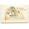 n°17864 - Carte Gaufrée - A Merry Chistmas - Père Noël veillant sur deux fillettes, l'une dormant l'autre priant