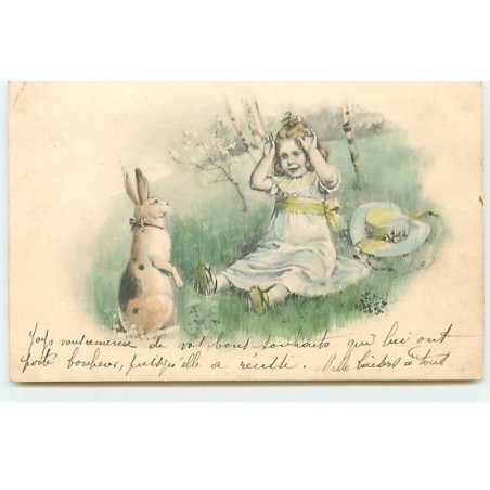 n°17889 - Lièvre regardant une fillette assise dans l'herbe