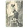 n°18612 - Jeune femme légèrement regardant par la fenête en fumant