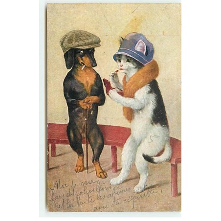 n°21044 - Teckel portant une casquette regardant une chatte se mettant du rouge à lèvres